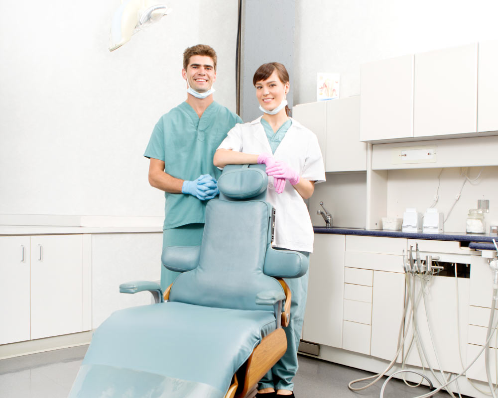 dentist and hygienist in dental treatment room