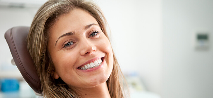 smiling woman sitting in a dental chair