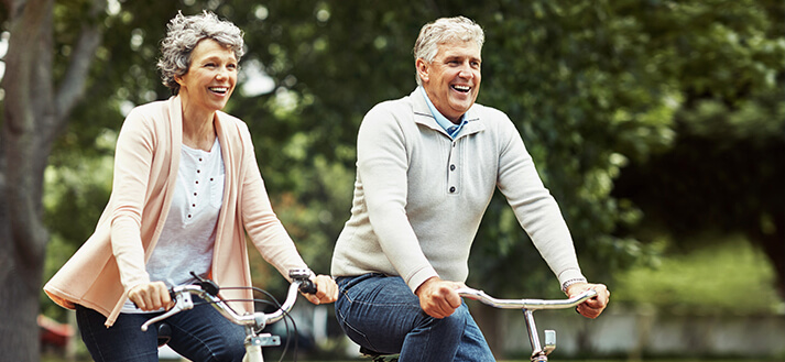 senior couple riding bikes