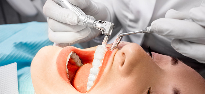 Woman getting professional teeth cleaning